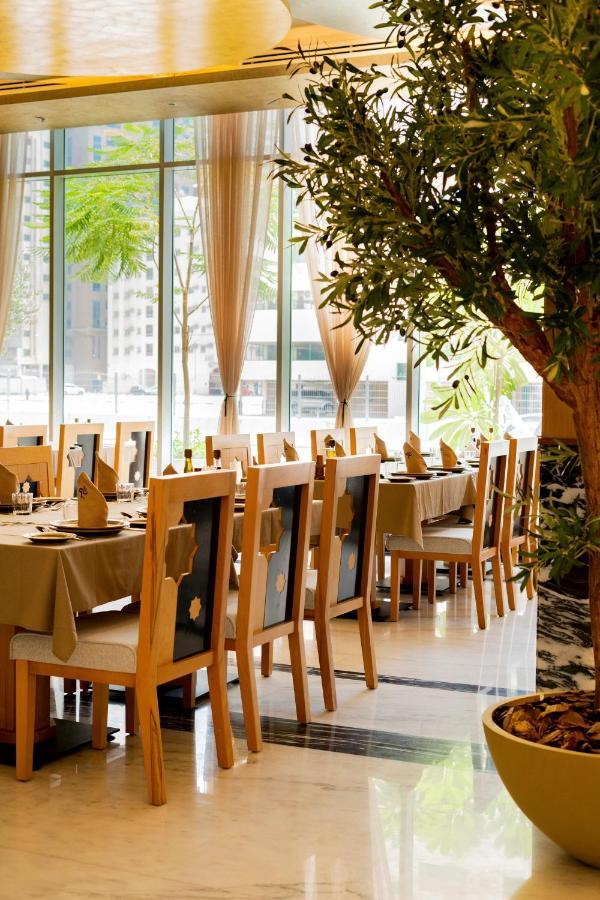 Luxe Grand Hotel Apartments Σάρτζα Εξωτερικό φωτογραφία Restaurant