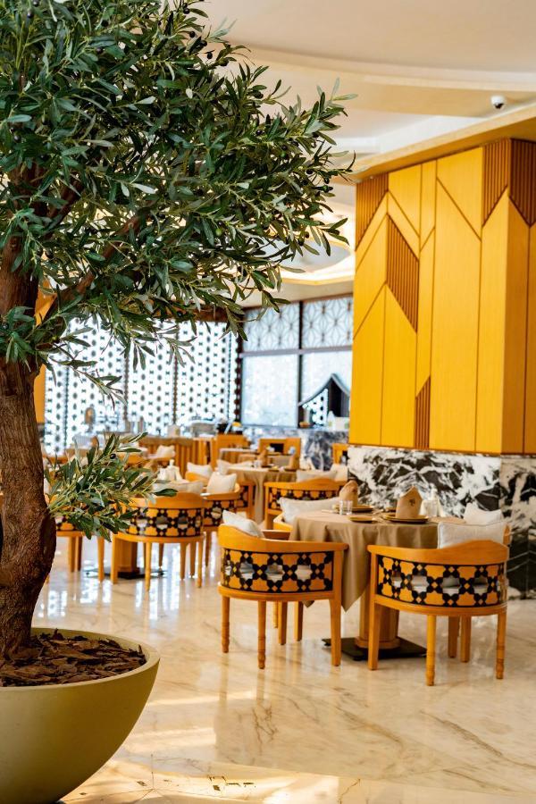 Luxe Grand Hotel Apartments Σάρτζα Εξωτερικό φωτογραφία The restaurant