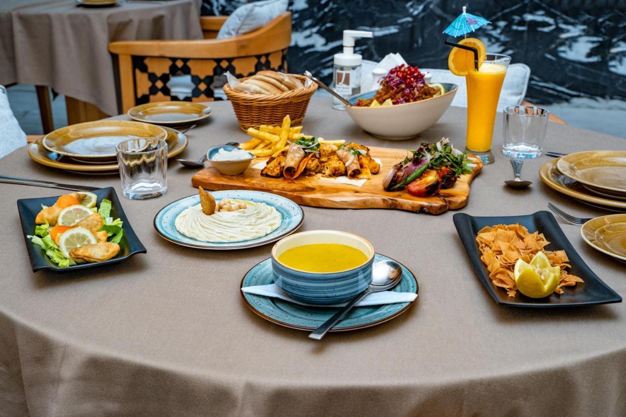 Luxe Grand Hotel Apartments Σάρτζα Εξωτερικό φωτογραφία A selection of Turkish cuisine